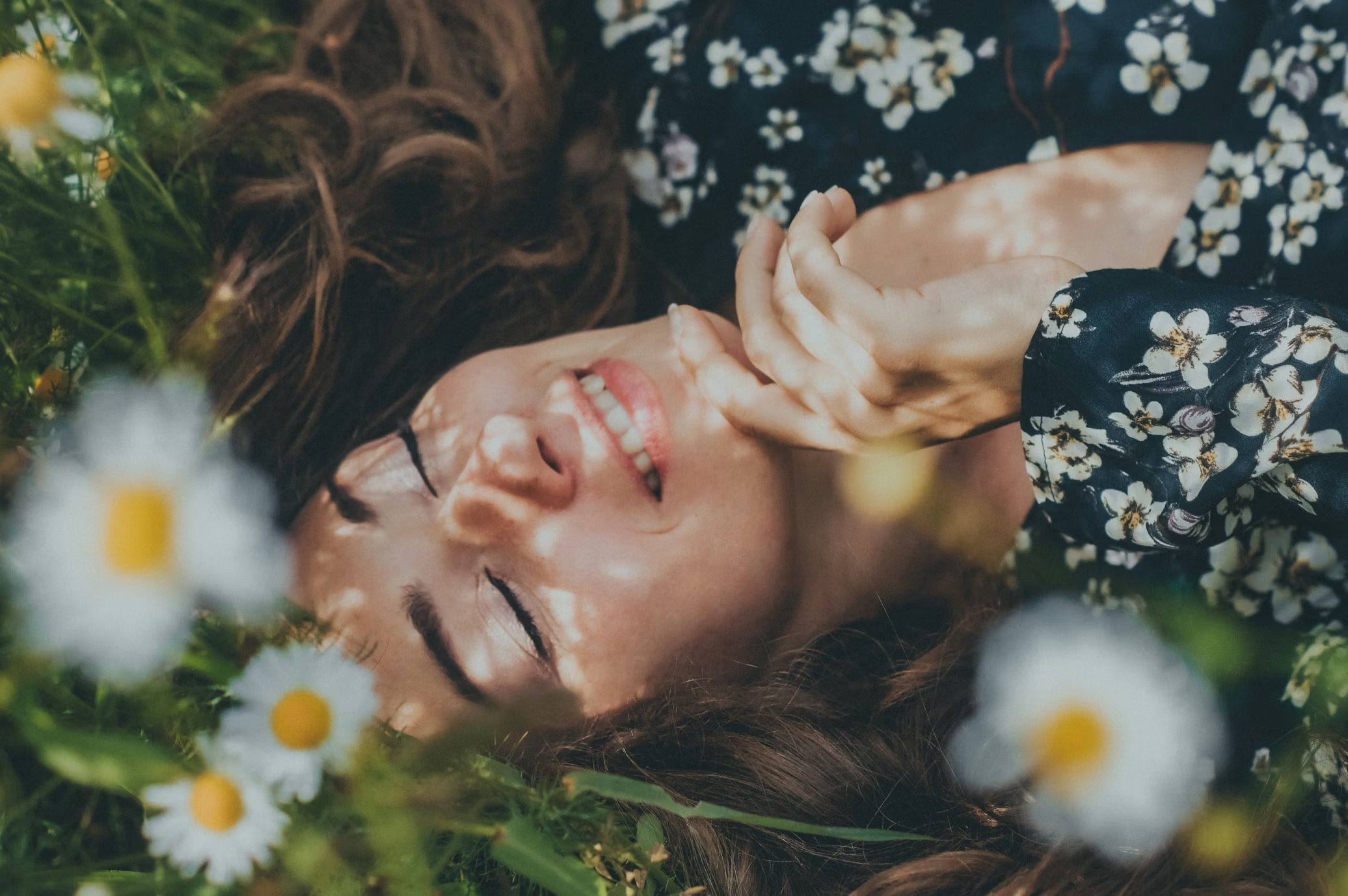 Woman resting in flowers waiting for her March zodiac sign